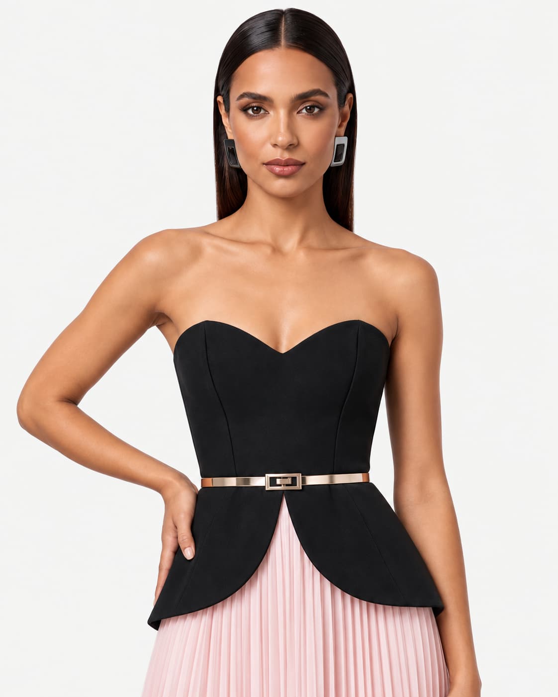Close-up — the sweetheart neckline, gold belt and the seam where the bodice meets the pleated skirt.