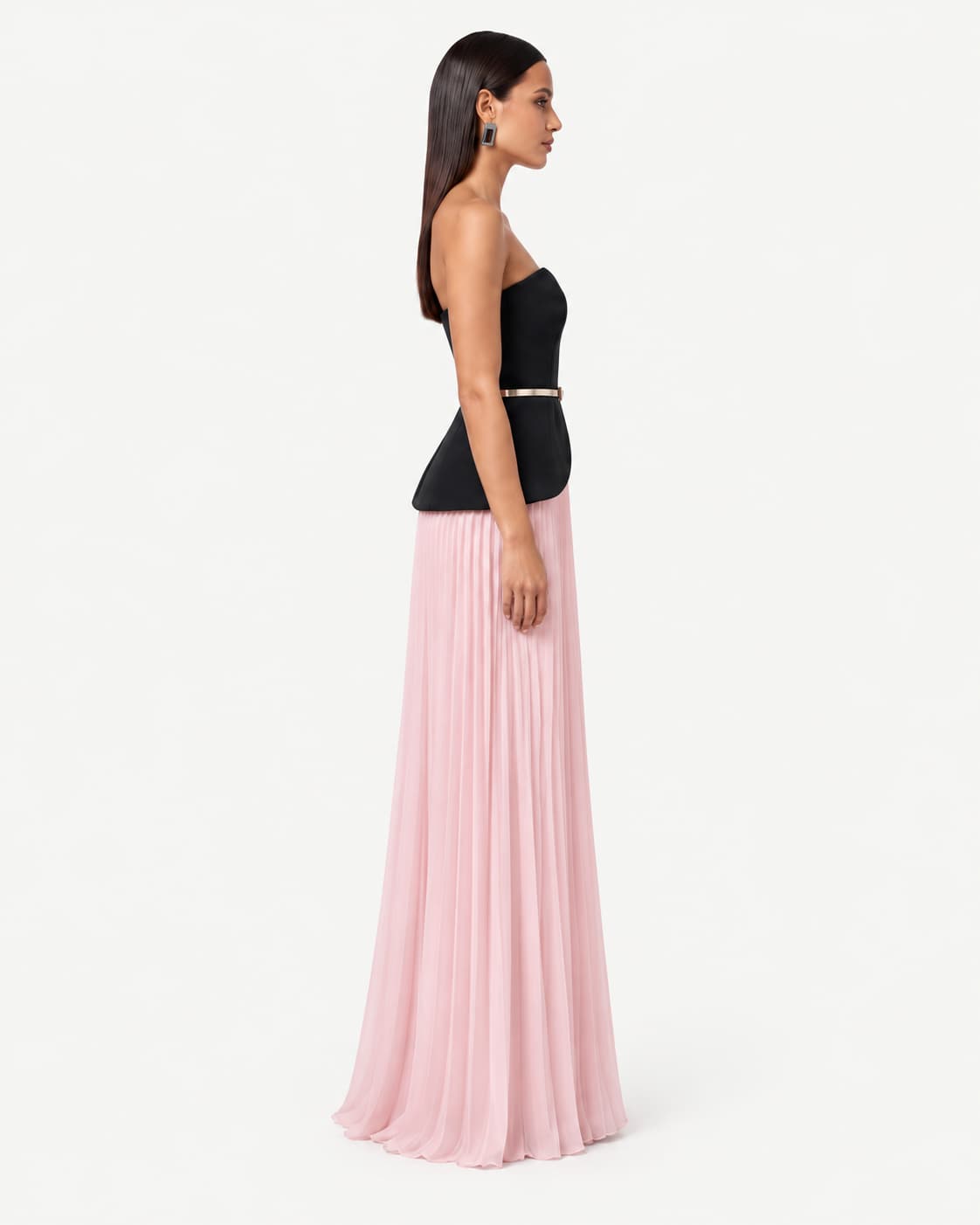 Side view — the bodice's profile and the full sweep of the pleated skirt.