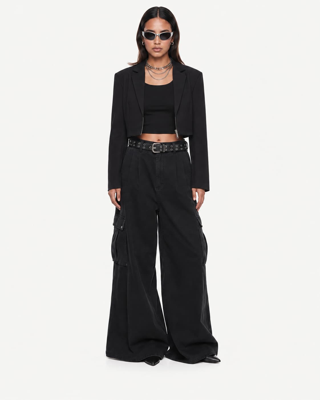 Front view — model in a cropped black blazer, black top and wide-leg cargo trousers, facing the camera.