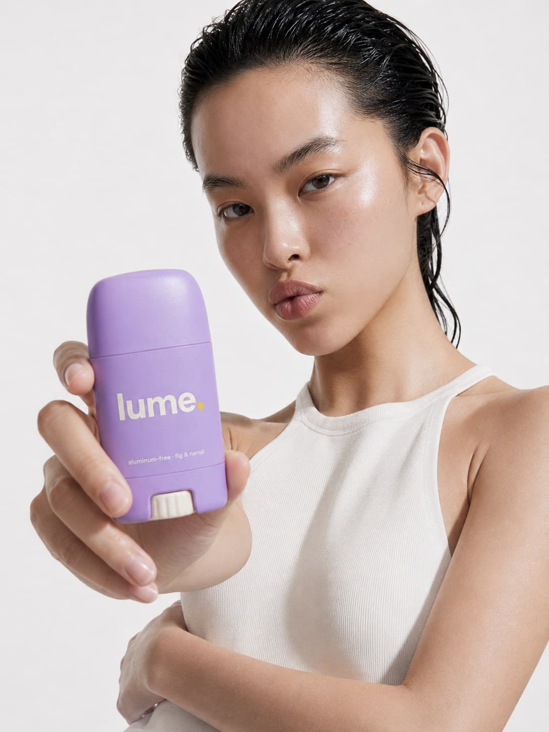 Model holding the Lume stick to camera.