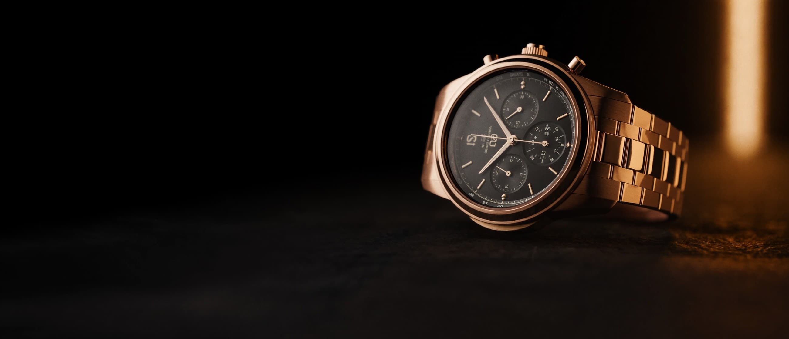 Haute horlogerie campaign — a rose-gold chronograph in warm cinematic light
